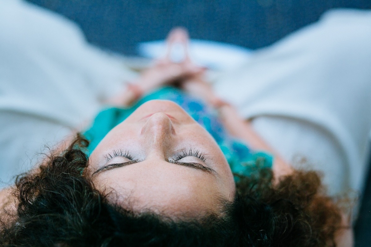 Overhead view of woman in stillness with eyes closed